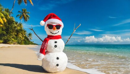 sandy snowman in christmas santa hat and sunglasses at ocean tropical beach