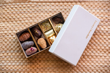 Chocolate box with golden words luxury chocolate  with mock up space and word in arabic,...