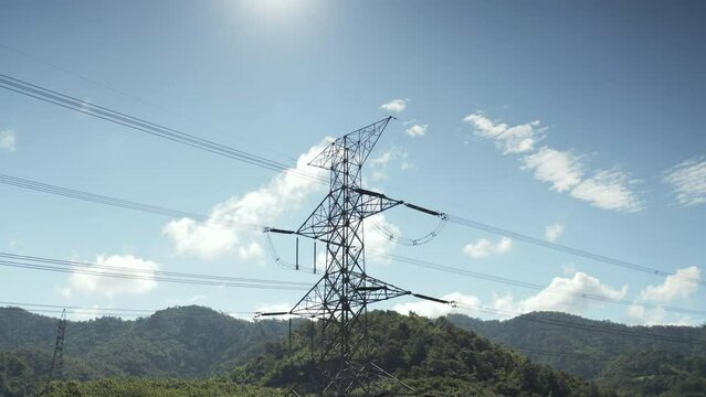 Transmission tower in aerial view. May called electricity pylon, steel utility pole consist of steel structure framing to support carry high-voltage cable or overhead power line for electrical grid.