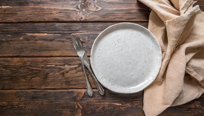 empty white plate with a beige linen napkin on a brown rustic background top view flat lay copy space - Powered by Adobe