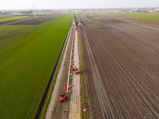 Laying of a pipe providing carbon dioxide gas to greenhouses. This captured and recycled gas was...
