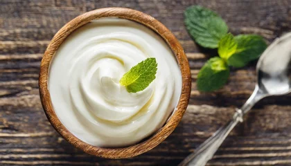 Fotobehang close up of white natural creamy vanilla yogurt top view © Aedan