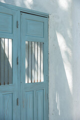 Blue color door with white wall