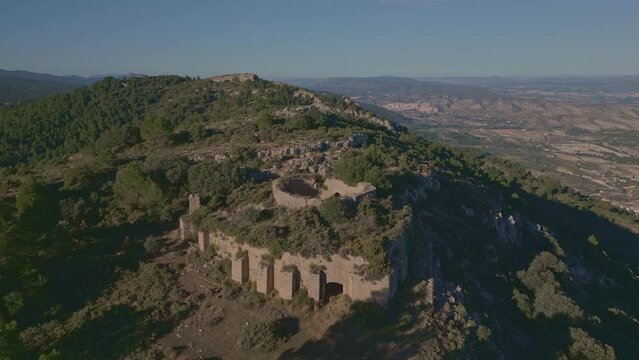 Aerial view looking at a nevera (snow pit) these snow pits were used in antiquity to preserve the fallen snow, Cava Don Miguel, Mariola mountain, Alicante, Spain - stock video