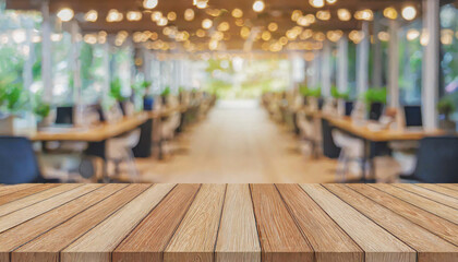 Wooden board on empty table in front of blurred background, perspective brown wood table over blur forest for mockup or product display, spring season