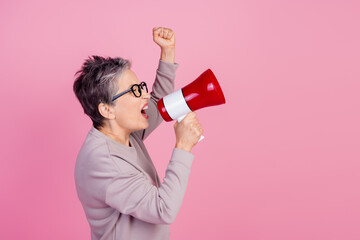 Profile side photo of confident retired woman hold bullhorn say tell announce information empty...