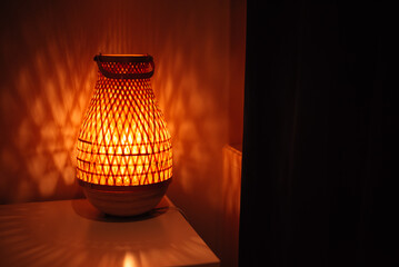 lamp with a wooden lampshade in a cozy apartment in the evening