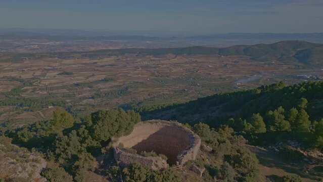 Aerial view looking at a nevera (snow pit) these snow pits were used in antiquity to preserve the fallen snow, Cava Don Miguel, Mariola mountain, Alicante, Spain - stock video