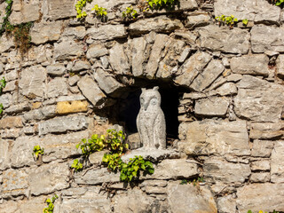 Stone owl in the wall
