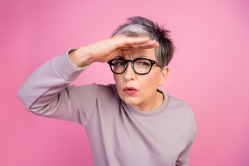 Close up photo of grey short haircut business woman searching employee who steal corporate budget isolated on pink color background