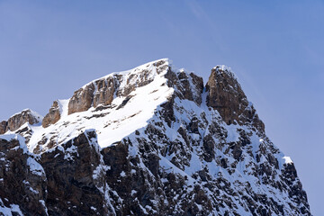 Scenic view of mountain panorama with snow covered mountain peaks in the Swiss Alps at mount Titlis on a sunny winter day. Photo taken February 21st, 2024, Titlis, Engelberg, Switzerland.