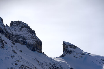 Scenic view of mountain panorama with snow covered mountain peaks in the Swiss Alps at mount Titlis on a sunny winter day. Photo taken February 21st, 2024, Titlis, Engelberg, Switzerland.