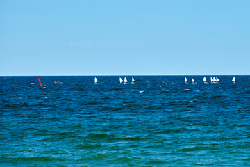 Blue sea sailing regatta, nautical spectacle sport sailing competition among yacht club participants symbolizing spirit of maritime sailing challenge, yacht racing hobby