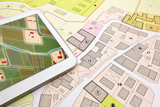Buildings Permit concept with imaginary cadastral on digital tablet - building activity and construction industry with General Urban Plan