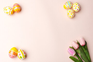 Easter background. Handmade painted eggs lie on a pink background. - 742750292