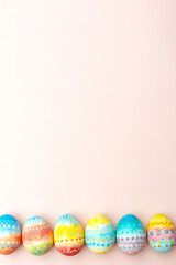 Easter background. Handmade painted eggs lie on a pink background. - 742750647