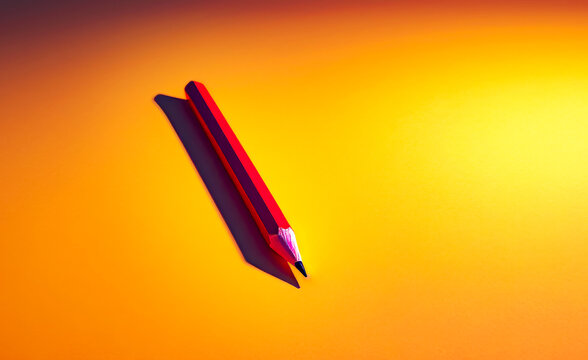 Red pencil laying on top of yellow surface with shadow on it.