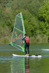 Naklejka premium a man is doing windsurf