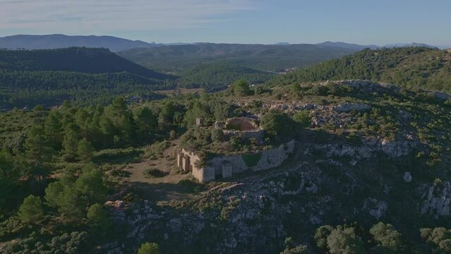 Aerial view looking at a nevera (snow pit) these snow pits were used in antiquity to preserve the fallen snow, Cava Don Miguel, Mariola mountain, Alicante, Spain - stock video