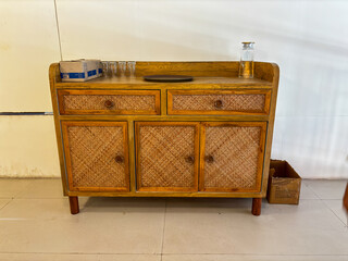 A wooden table front view having drawers.