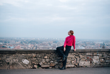 girl in a pink sweater in Bergamo