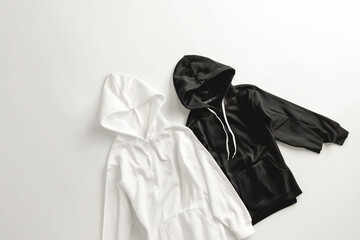 beautiful black and white hoodies a flat lay with copy space, clothing store, clothing delivery