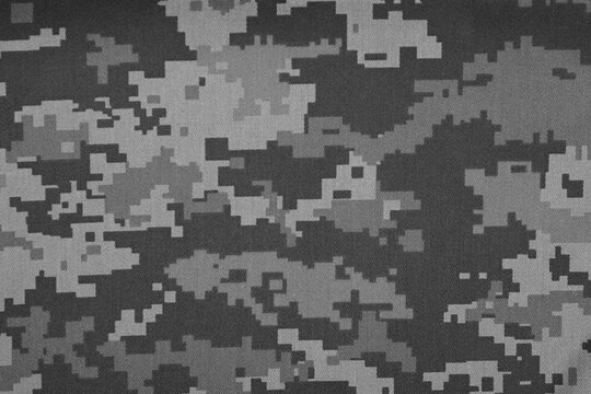 Texture of camouflage fabric as background, top view. Black and white effect