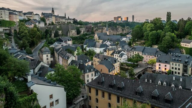 Grand Duchy of Luxembourg time lapse, city skyline day to night at Grund along Alzette river in the historical old town