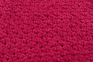Ruby, burgundy, crimson red soft and fluffy knitted texture, background