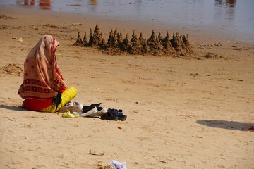 a woman sitting on beach 19 feb 2024 , Golden Beach, Puri, Odisha , india
