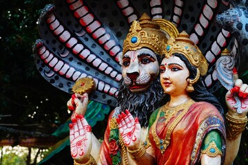 figurine of narsimha god with goddess laxmi