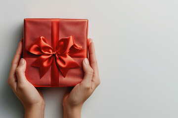 hands holding a birthday gift, white background. AI Generated
