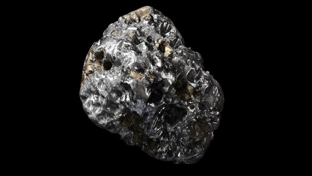 Realistic abstract looping 3D animation of the spinning platinum nugget with mineral inclusions rendered in UHD with alpha matte