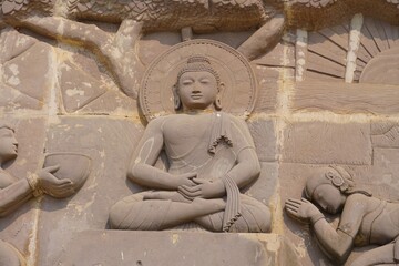 wall statues of buddha on temple wall