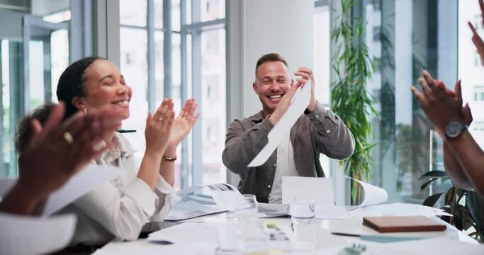 High five, applause and throwing paper with business people in boardroom of office together. Collaboration, success or motivation with man and woman employee team clapping in workplace meeting