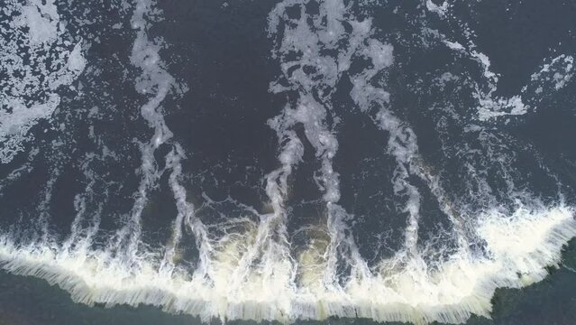 Aerial top down drone shot revealing Europe's widest waterfall Venta rapid, Kuldīga, Latvia