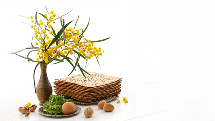 Matzah, Acacia dealbata flowers, walnuts and other attributes of the Jewish holiday Pesach...