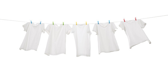 Many t-shirts drying on washing line isolated on white, low angle view