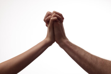 Man’s and woman’s hands intertwined as a sign of strong, deep bond and support, on white background