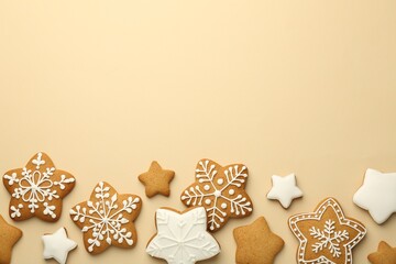 Tasty Christmas cookies with icing on beige background, flat lay. Space for text