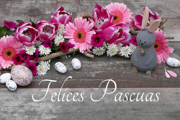 Greeting card Happy Easter: Easter decoration on rustic wood with the inscription Happy Easter.