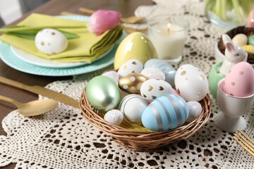Obraz na płótnie Canvas Festive table setting with painted eggs. Easter celebration