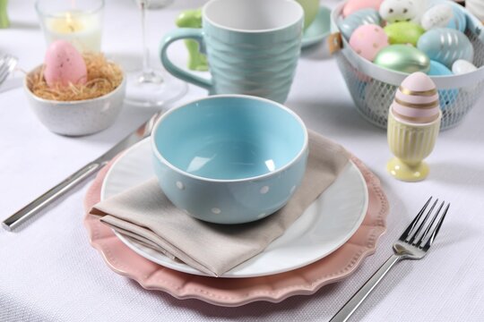 Festive table setting with painted eggs. Easter celebration