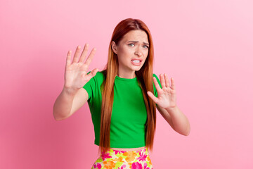 Portrait of frightened scared girl with redhead hairstyle wear stylish top holding palms say no...