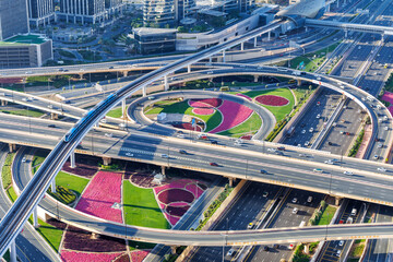 Dubai crossroads of Sheikh Zayed Road highway interchange traffic near Burj Khalifa with metro