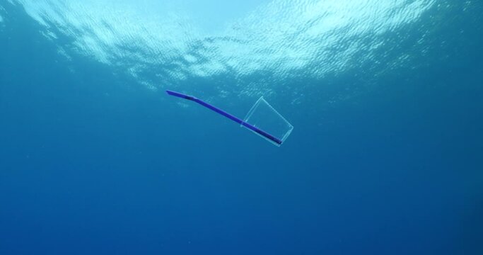 plastic waste underwater bad for fish with sun rays  background ocean pollution