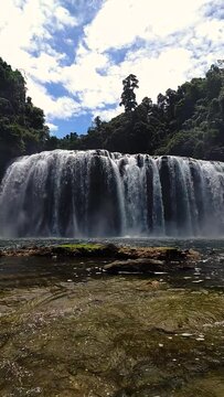 Water splash from waterfalls in Bislig. Tinuy-an Falls. Surigao del Sur. Philippines. Vertical view.