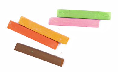 Colorful chalks isolated on white background, top view