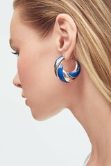 Close up portrait of a beautiful elegant woman with stylish jewelry on a white background. cute...