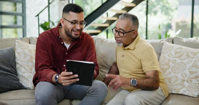 Mature man, son and tablet on sofa to scroll, social media and stream video online in living room. Happy family, talking and browse on touchscreen for digital movie and multimedia with technology